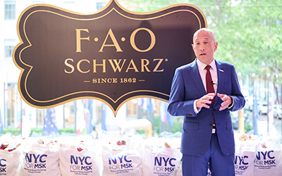 Dr. Andrew Kung, Chair of the Department of Pediatrics and Lila Acheson Wallace Chair in Pediatric Research at MSK, speaks to NYC for MSK attendees at FAO Schwarz.