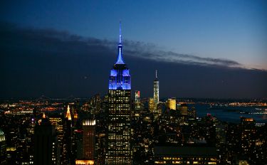 Topping the New York City skyline, the Empire State Building is lit up in MSK’s signature blue.