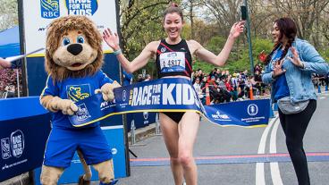 Runner cheering crossing the finish line  